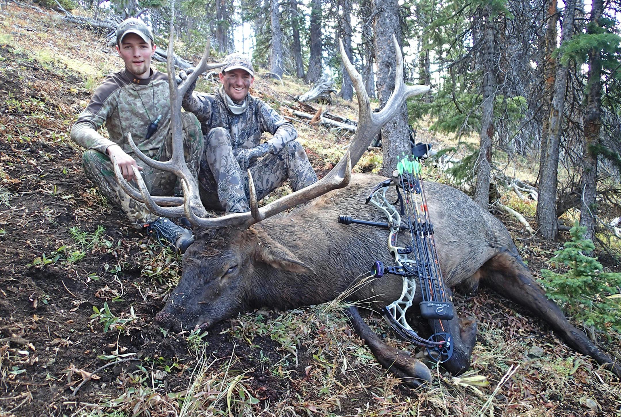 Friends and hunting partners Alec Underwood, left, and Trevor Anderson help each other while stalking and calling elk. This time Underwood did much of the calling, while Anderson arrowed this big 6x6 bull elk.