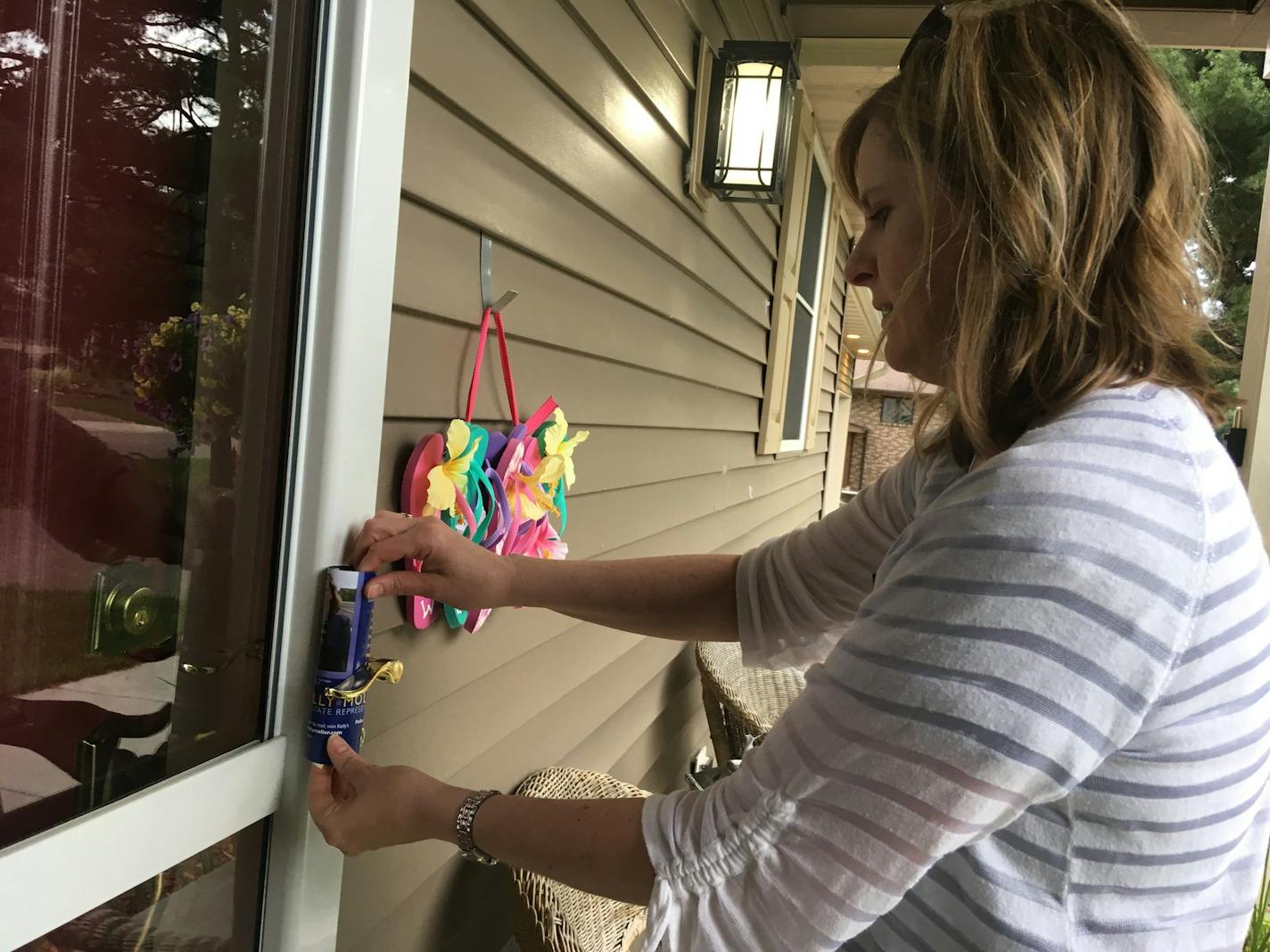 Kelly Moller, a first-time candidate who hopes to represent Arden Hills, Mounds View and Shoreview in the state House, knocks on doors in Mounds View on Thursday.