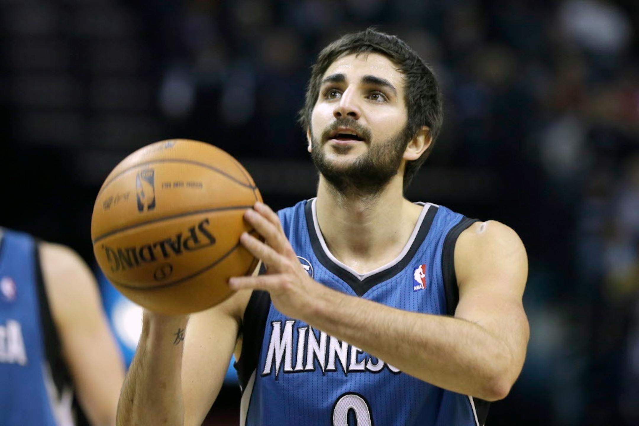 Minnesota Timberwolves guard Ricky Rubio attempts a free-throw in the first half of an NBA basketball game against the Memphis Grizzlies in December 2013.