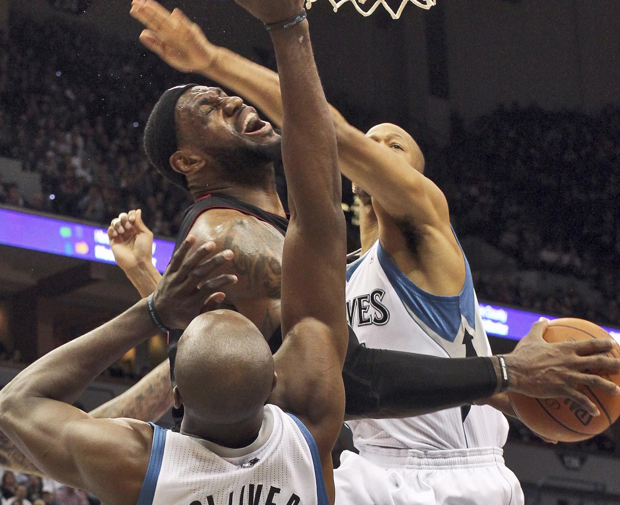 Minnesota Timberwolves vs. Miami Heat. Miami's Lebron James drove to the basket against the Wolves defense.