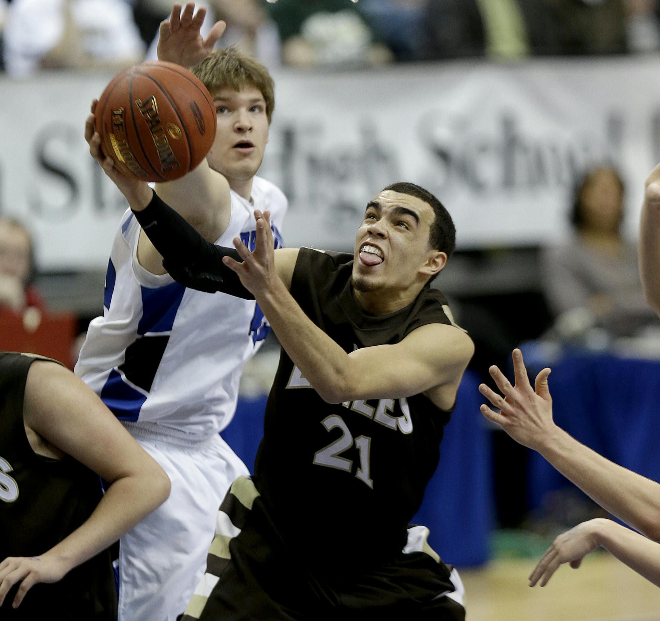 Apple Valley's Tyus Jones went up for two under pressure by Brainerd's Jagar Hanson during the second half of the boys' basketball quarterfinals at the Target Center, Wednesday, March 20, 2013 in Minneapolis, MN. Apple Valley defeated Brainerd 81-67.(ELIZABETH FLORES/STAR TRIBUNE) ELIZABETH FLORES • eflores@startribune.com
