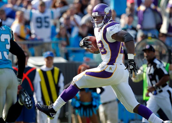 Vikings running back Adrian Peterson ran after a catch for a touchdown in 2011.