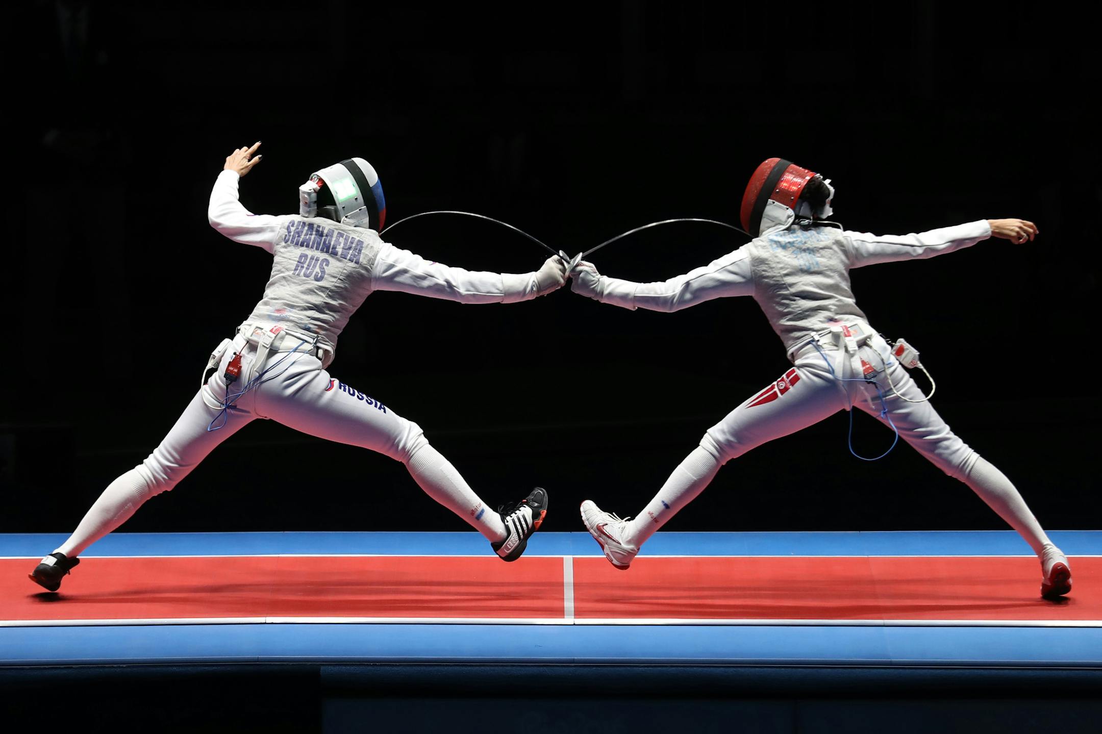 Russiaís Aida Shanaeva (left) and Tunisiaís Ines Boubakri battled it out in the womenís foil bronze medal bout. Boubakri won the match and the bronze medal. ] 2016 Summer Olympic Games - Rio Brazil brian.peterson@startribune.com Rio de Janeiro, Brazil - 08/10/2016 ORG XMIT: MIN1608101954130326