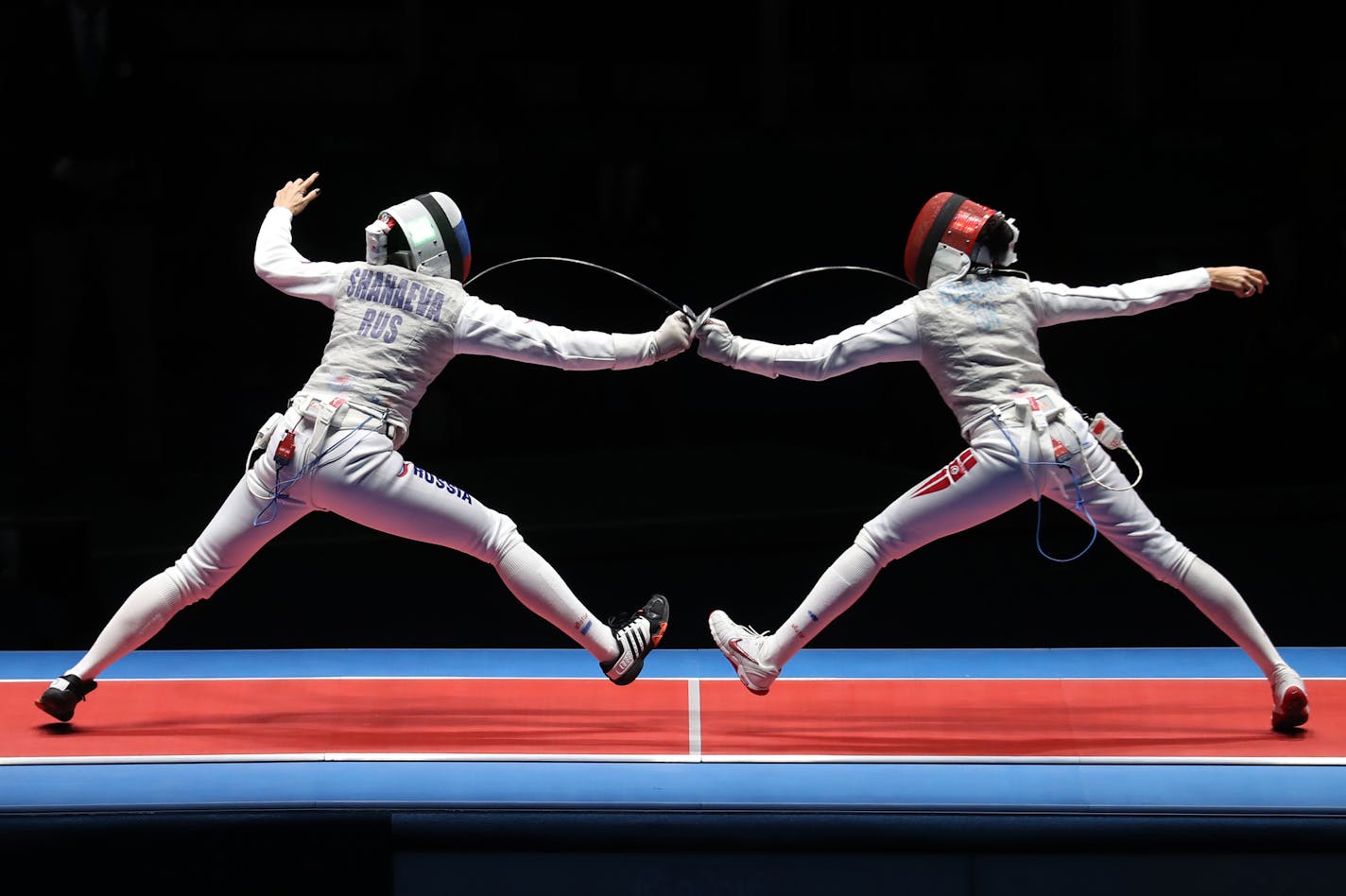 Russia&#xed;s Aida Shanaeva (left) and Tunisia&#xed;s Ines Boubakri battled it out in the women&#xed;s foil bronze medal bout. Boubakri won the match and the bronze medal. ] 2016 Summer Olympic Games - Rio Brazil brian.peterson@startribune.com Rio de Janeiro, Brazil - 08/10/2016 ORG XMIT: MIN1608101954130326