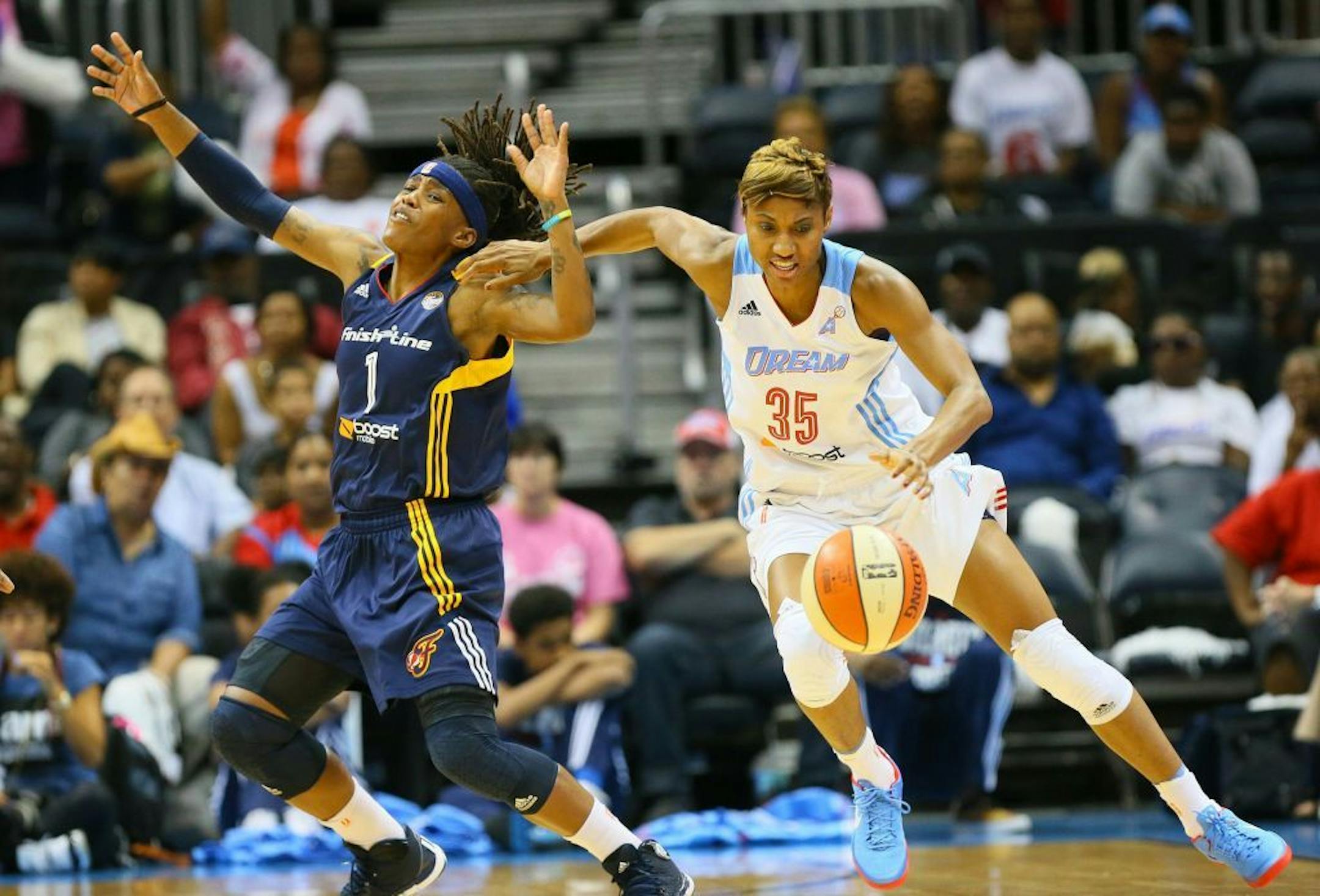 The Atlanta Dream's Angel McCoughtry (35) steals the ball from the Indiana Fever's Shavonte Zellous (1) during Game 1 of the WNBA Eastern Conference Finals at Philips Arena in Atlanta, Georgia, on Thursday, September 26, 2013.