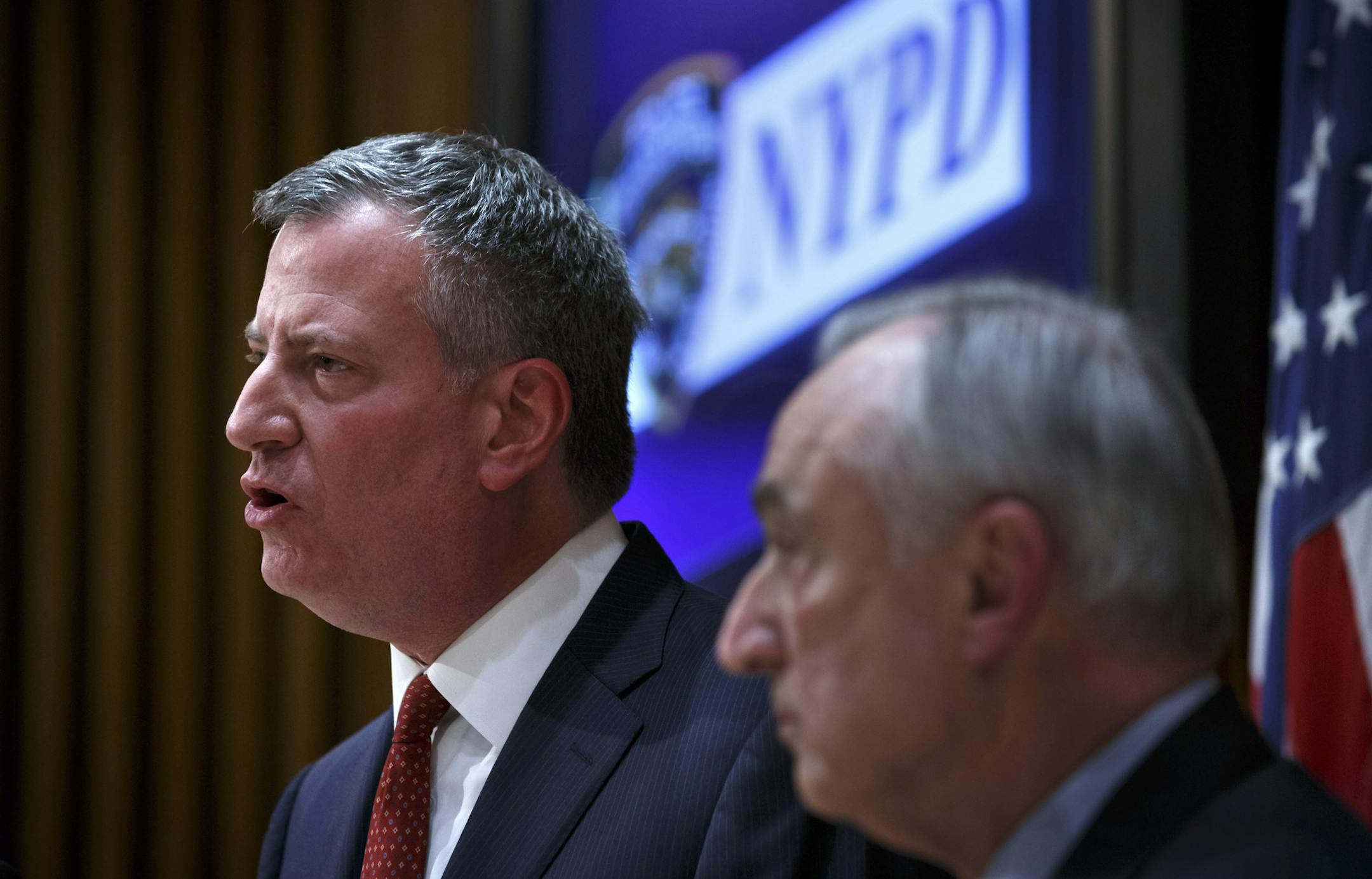 New York Mayor Bill de Blasio and Police Commissioner William Bratton at a news conference at One Police Plaza in New York, Dec. 22, 2014. Mayor Bill de Blasio on Monday called for protesters to suspend demonstrations in the aftermath of the killing of two officers, who were gunned down as they sat in their patrol car. (Richard Perry/The New York Times)