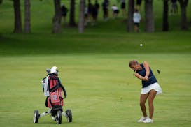 Reese McCauley of Simley hits an approach shot Wednesday during the 3A girls golf tournament.



The Class 3A state golf championship was held at Bunk
