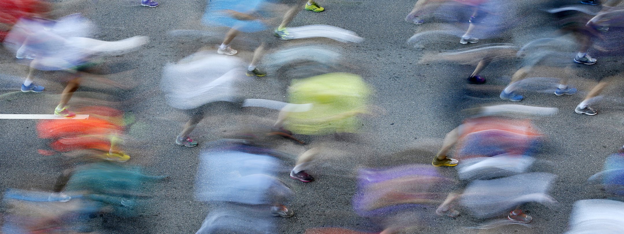 Runners had a perfect day for a Marathon creating a blur of bodies in motion for the start in downtown Minneapolis.Nick Arciniaga won the 2013 Medtronic Twin Cities Marathon. ] BRIAN PETERSON ‚Ä¢ brianp@startribune.com St. Paul, MN - 10/06//2013