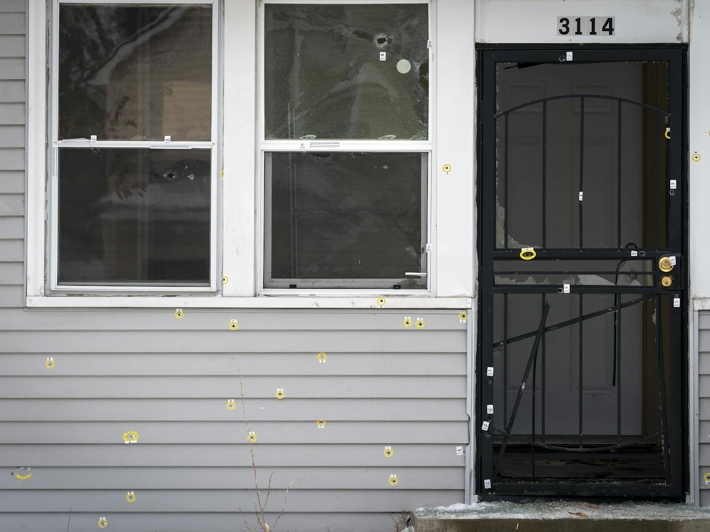 Bullet holes riddle the front of the house at 3114 N. Thomas Avenue in Minneapolis that was the scene of Sunday's police-involved shooting. ] LEILA NAVIDI &#x2022; leila.navidi@startribune.com BACKGROUND INFORMATION: The home at 3114 N. Thomas Avenue in Minneapolis that was the scene of Sunday's police-involved shooting, in which nine officers are said to have fired their weapons after a man emerged from his home clutching a Soviet-designed assault rifle. Photographed on Tuesday, December 17, 20