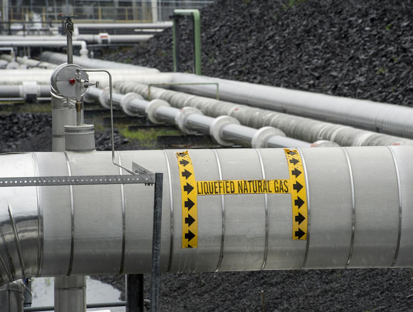 FILE - This June 12, 2014 file photo shows Dominion Energy's Cove Point LNG Terminal in Lusby, Md. Natural gas overtook coal as the top source of U.S. electric power generation for the first time ever in April of 2015, a milestone that has been in the making for years as the price of gas slides and new regulations make coal more risky for power generators. (AP Photo/Cliff Owen, File)