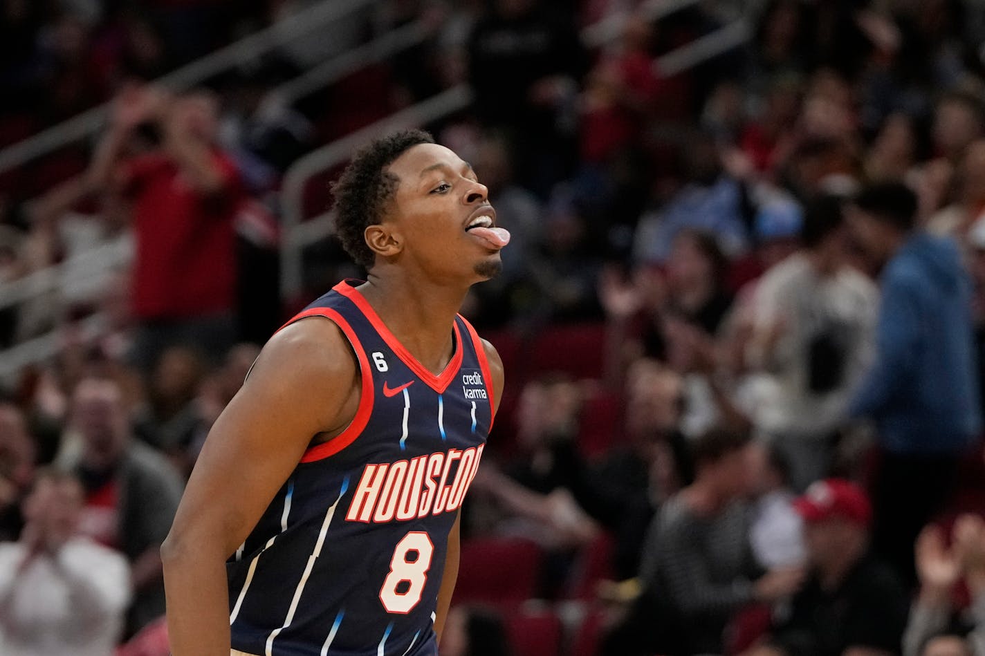 Houston Rockets' Jae'Sean Tate (8) celebrates after making a basket against the Utah Jazz during the second half of an NBA basketball game Thursday, Jan. 5, 2023, in Houston. The Jazz won 131-114. (AP Photo/David J. Phillip)