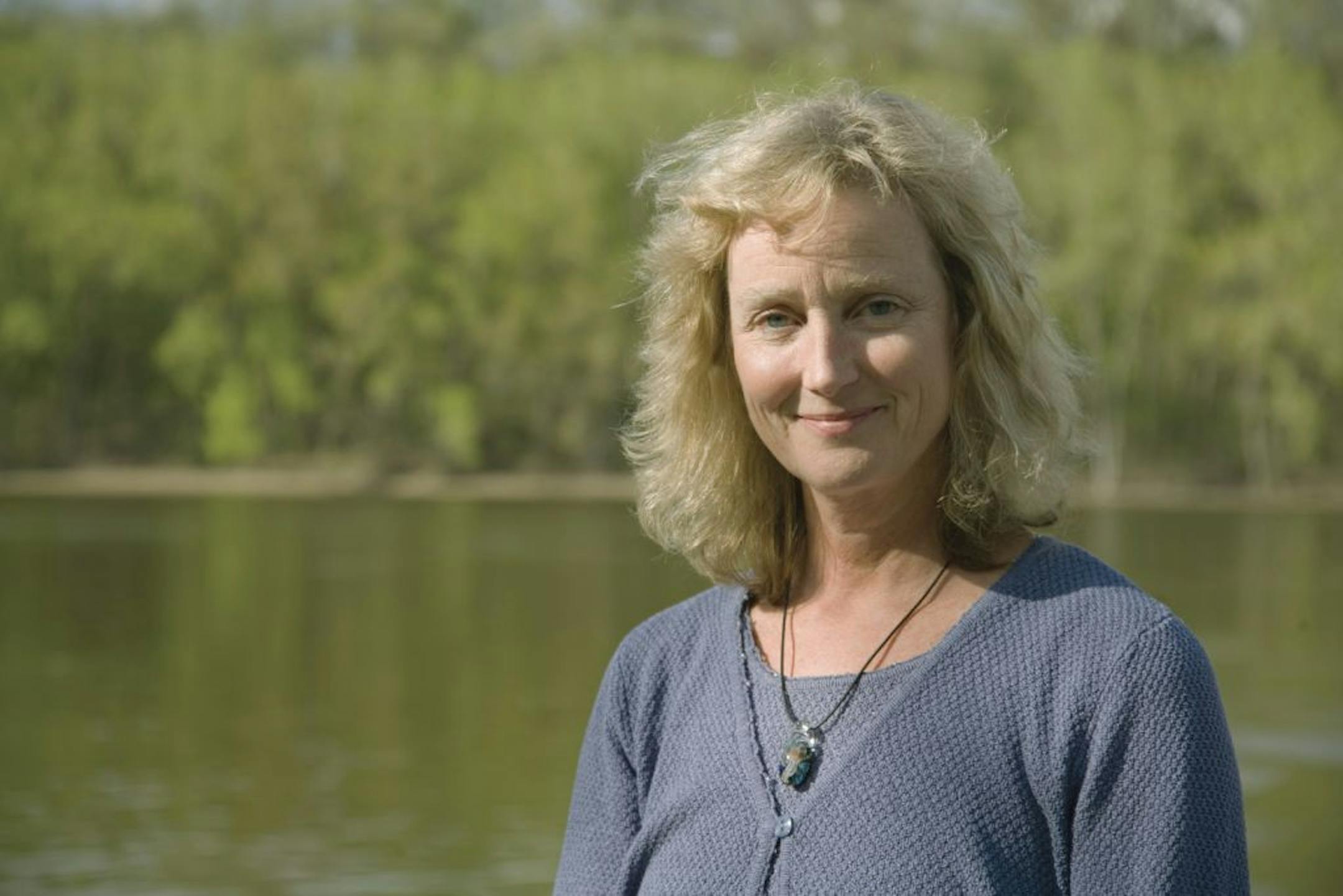 Deborah Swackhamer, director of University of Minnesota's Water Resources Center, along the Mississippi River in 2009