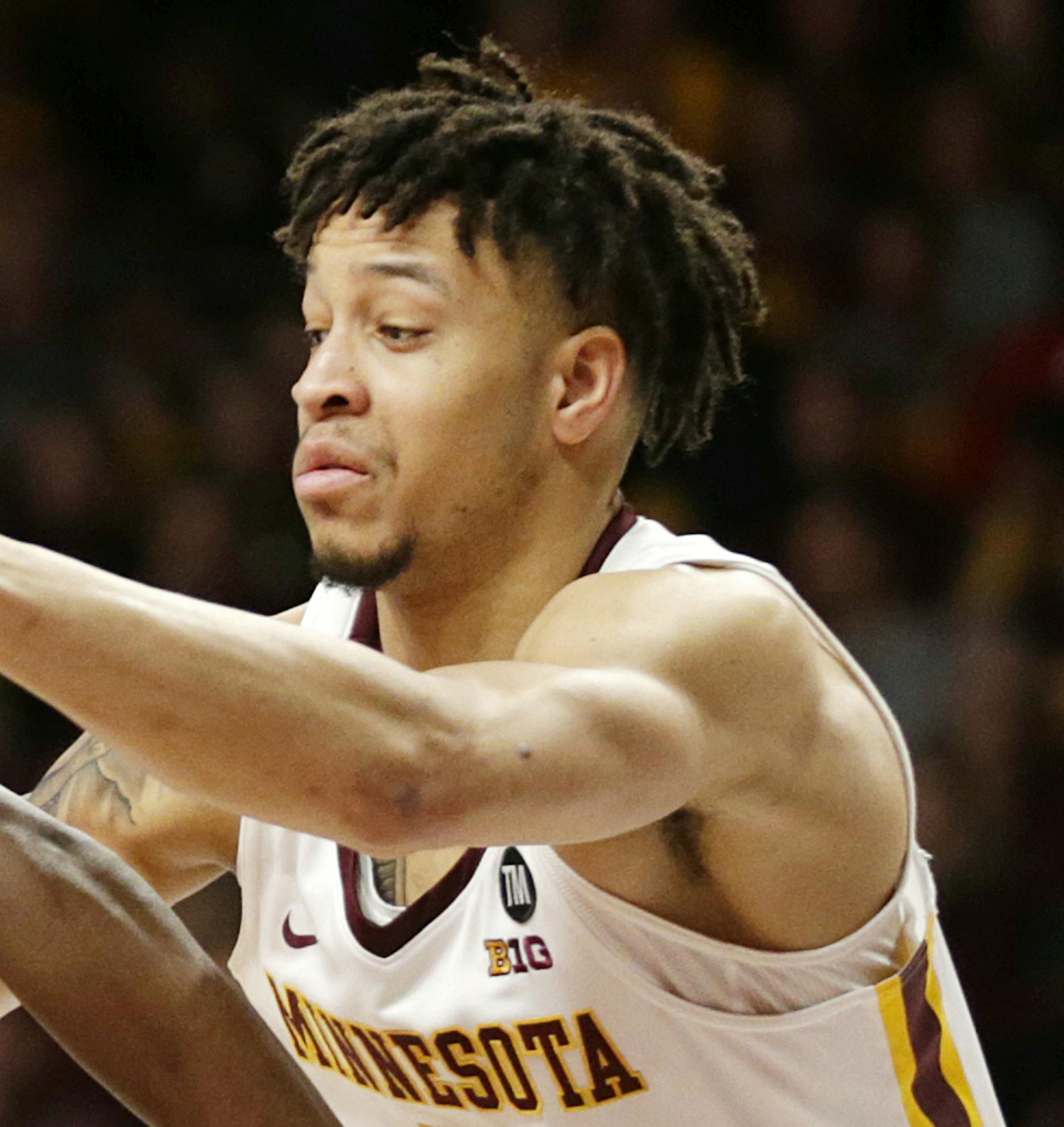 Rutgers guard Montez Mathis (23) drives on Minnesota guard Amir Coffey (5) during the second half of an NCAA college basketball game Saturday, Jan. 12, 2019, in Minneapolis. Minnesota defeated Rutgers 88-70. (AP Photo/Andy Clayton-King)
