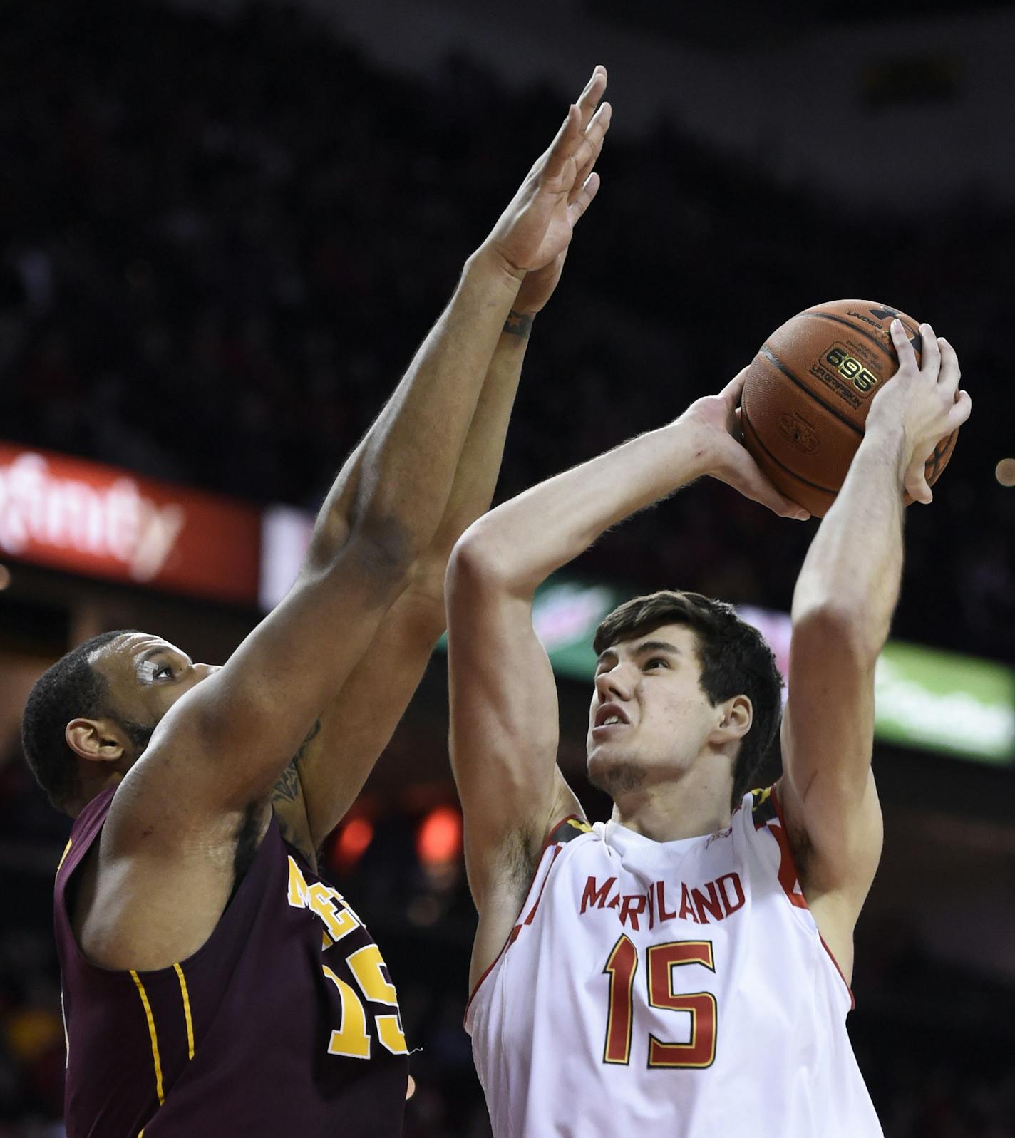 Maryland forward Michal Cekovsky shoots as Minnesota forward Maurice Walker blocks during the second half of an NCAA college basketball game Saturday, Jan. 3, 2015 in College Park, Md. Maryland won 70-58. (AP Photo/Gail Burton)