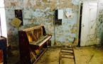 As if someone were about to play a concerto, a decaying piano still stands in a store in the abandoned town of Pripyat. (Cheryl L. Reed/Chicago Tribun