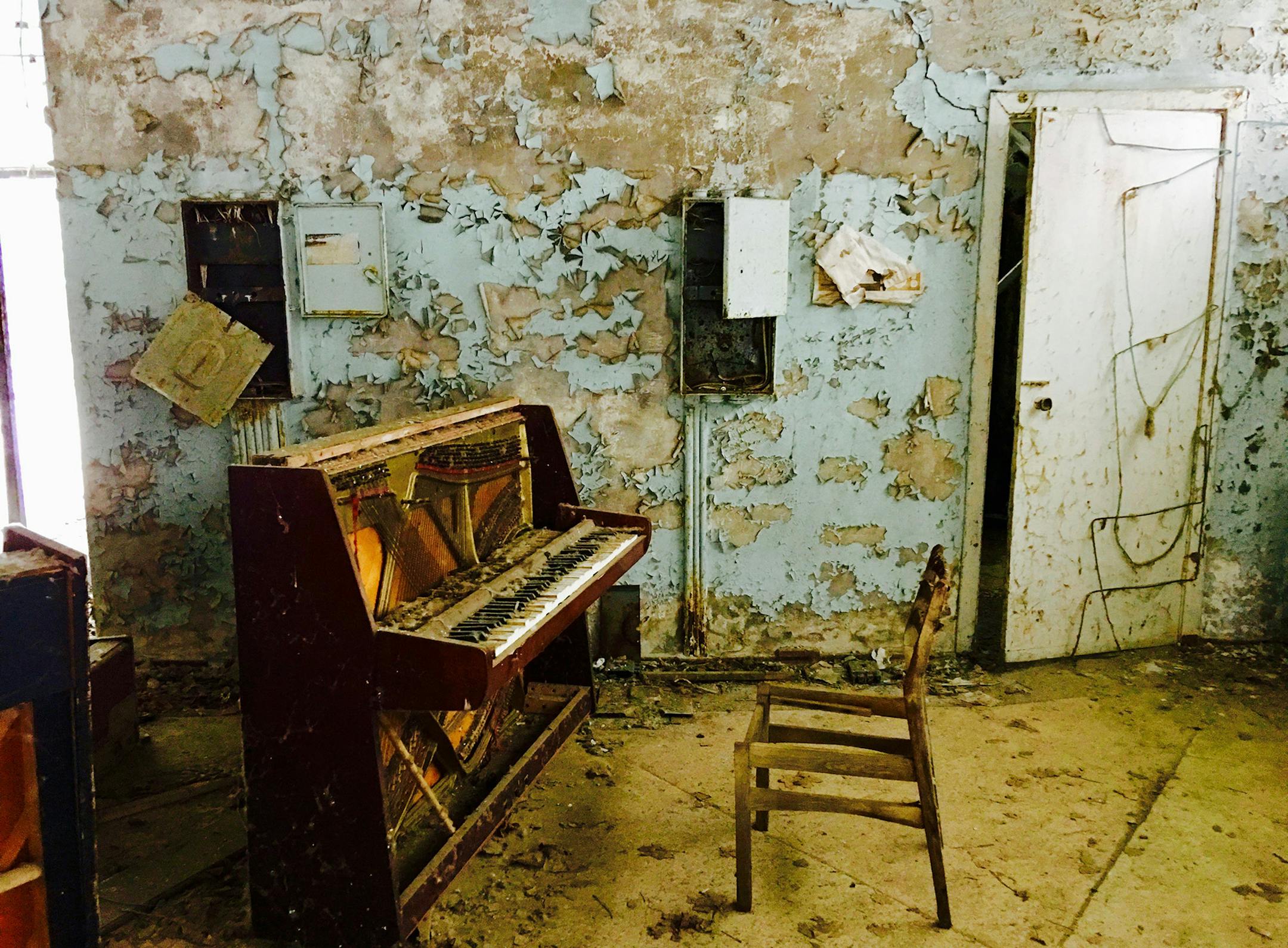As if someone were about to play a concerto, a decaying piano still stands in a store in the abandoned town of Pripyat. (Cheryl L. Reed/Chicago Tribune/TNS)