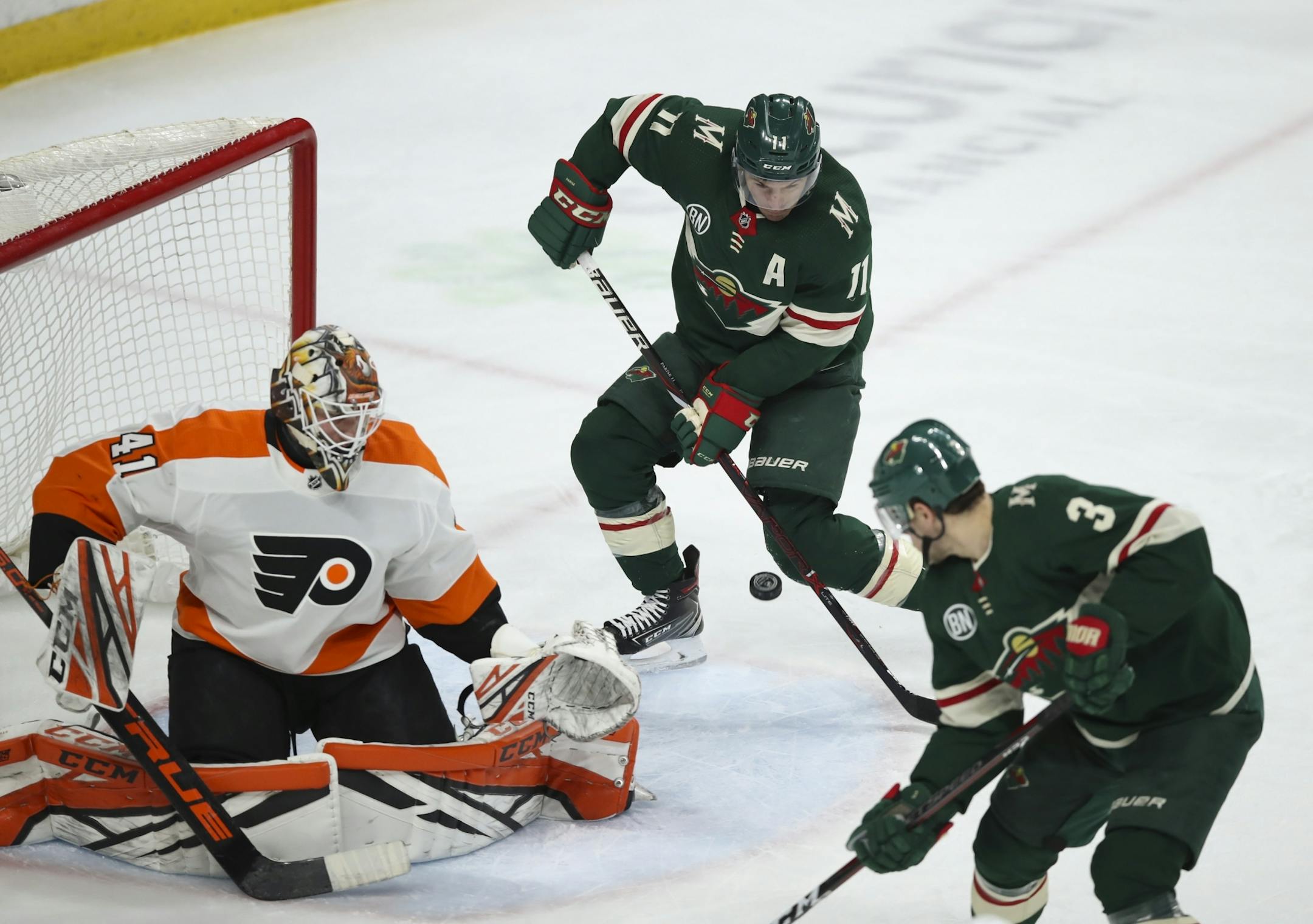 Minnesota Wild left wing Zach Parise (11) fanned on a puck passed by Minnesota Wild center Charlie Coyle (3) in the third period with Philadelphia Flyers goaltender Anthony Stolarz (41) out of position.