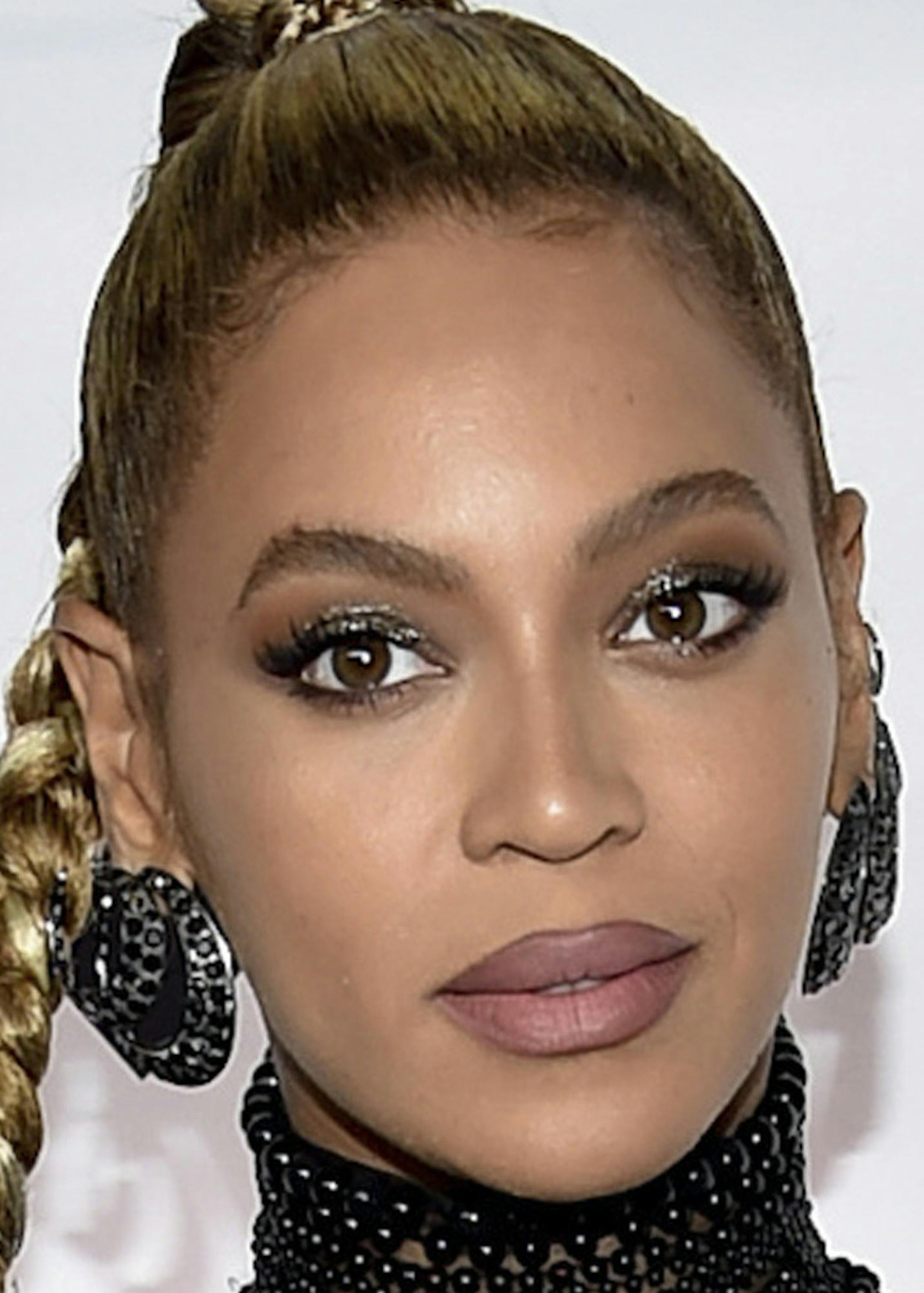 FILE - In this Oct. 15, 2016, file photo, singer Beyonce Knowles attends the Tidal X: 1015 benefit concert in New York. Beyonce set a record for earning Grammy nominations, announced Tuesday, Dec. 6, in the rock, pop, R&B and rap categories in the same year with her diverse album, “Lemonade.” Only two other acts have earned nominations in those same four categories, Paul McCartney and Janet Jackson, but never in the same year. (Photo by Evan Agostini/Invision/AP, File)
