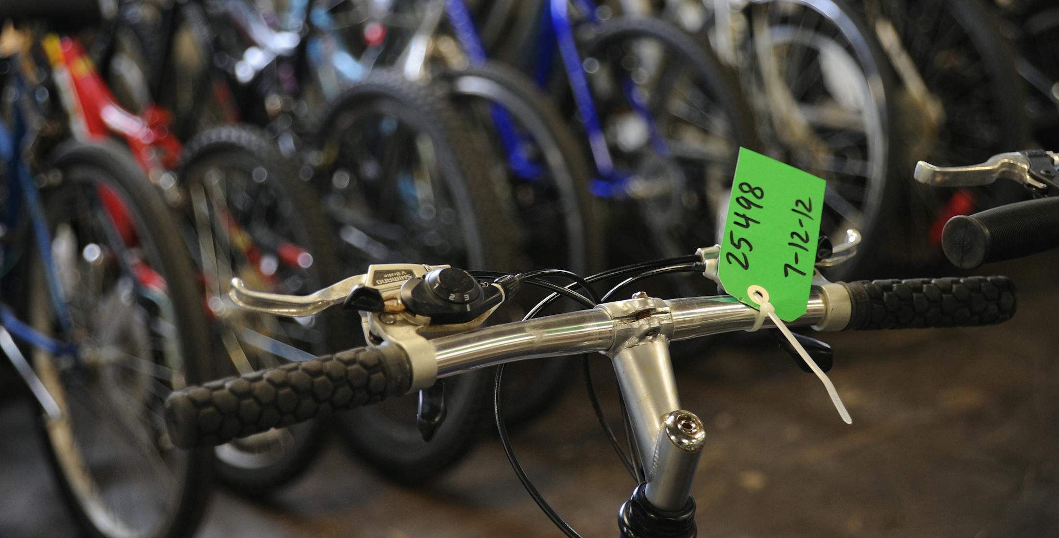 Lost or stolen bikes are tagged and held in storage until they are sold or disposed .The Twin Cities bike community says the issue of bike theft is far more extensive and sophisticated than many people imagine. Yet local law enforcement say part of the problem lies with the people who lose bikes. Without a serial number to return the bike, many end up in police possession or auctioned off.] Richard.Sennott@startribune.com Richard Sennott /Star Tribune. , Minneapolis, Minn. Friday 08/03/12) ** (c