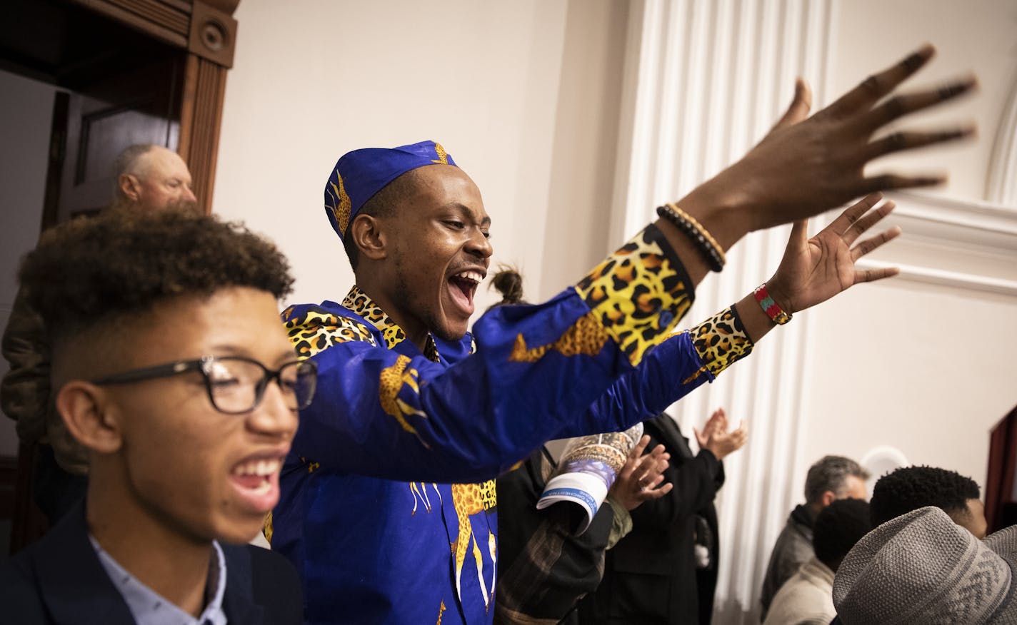 Mathias "Ngasii" Katushabe of Cape Town cheers during the Minnesota Orchestra's encore.