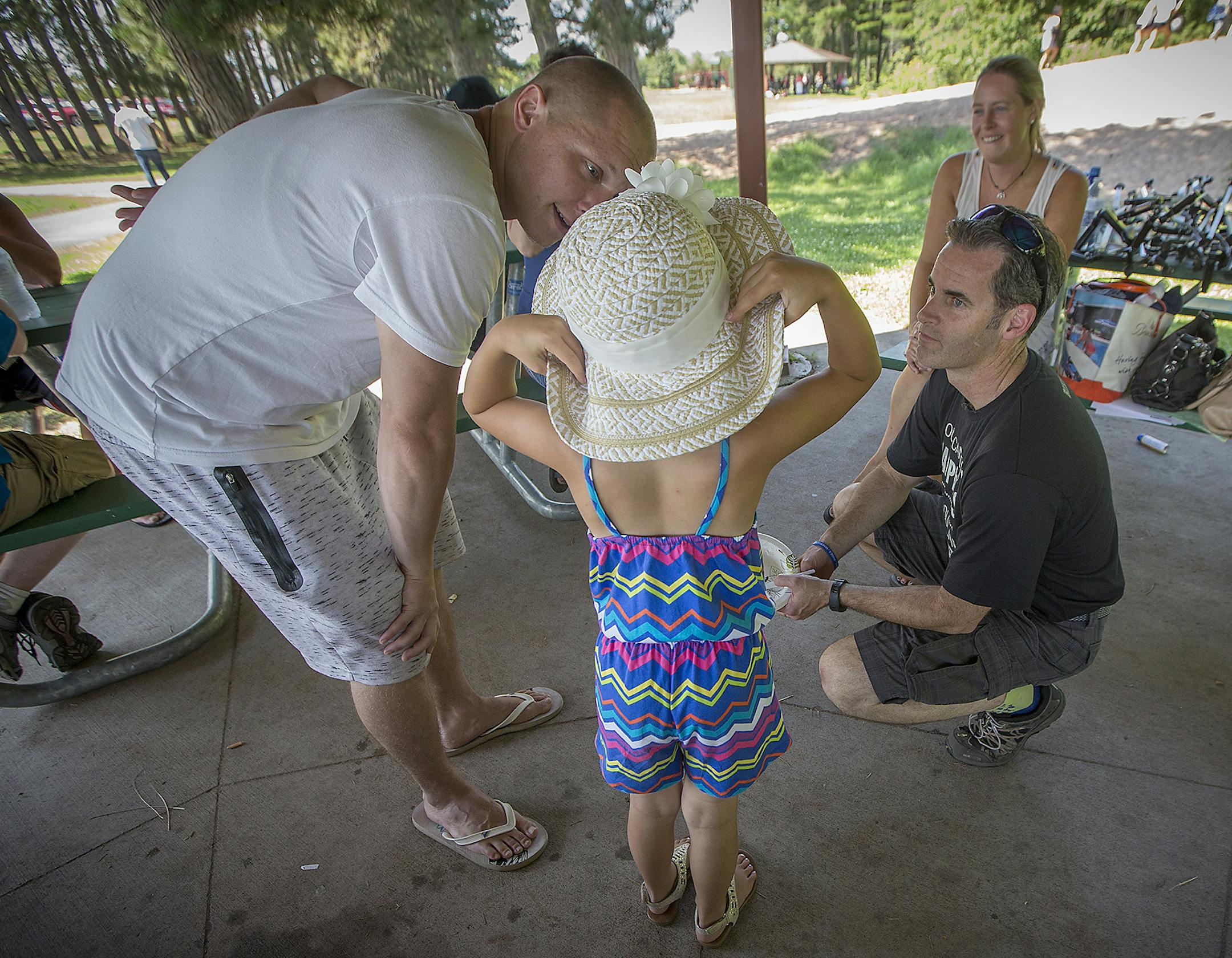 Shaun Floerke, right, checked in with defendants and their families including Shawn Wirta during a picnic his office organized with DWI defendants in July in Duluth.