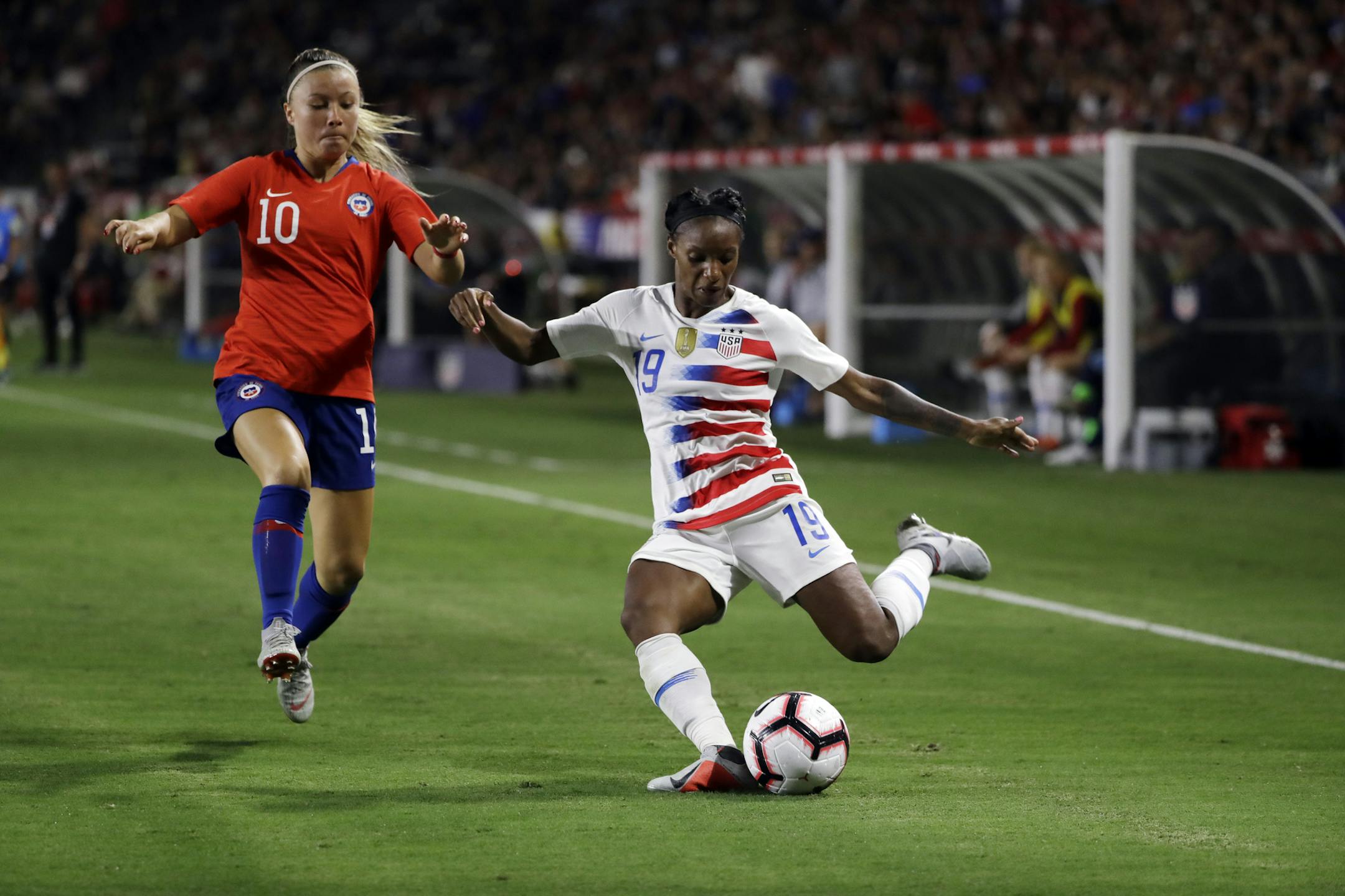 The U.S. national team's Crystal Dunn, right, in an international friendly last August in Carson, Calif., also plays midfielder for the NWSL champion North Carolina Courage.