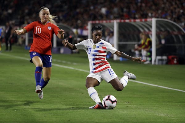 The U.S. national team's Crystal Dunn, right, in an international friendly last August in Carson, Calif., also plays midfielder for the NWSL champion 
