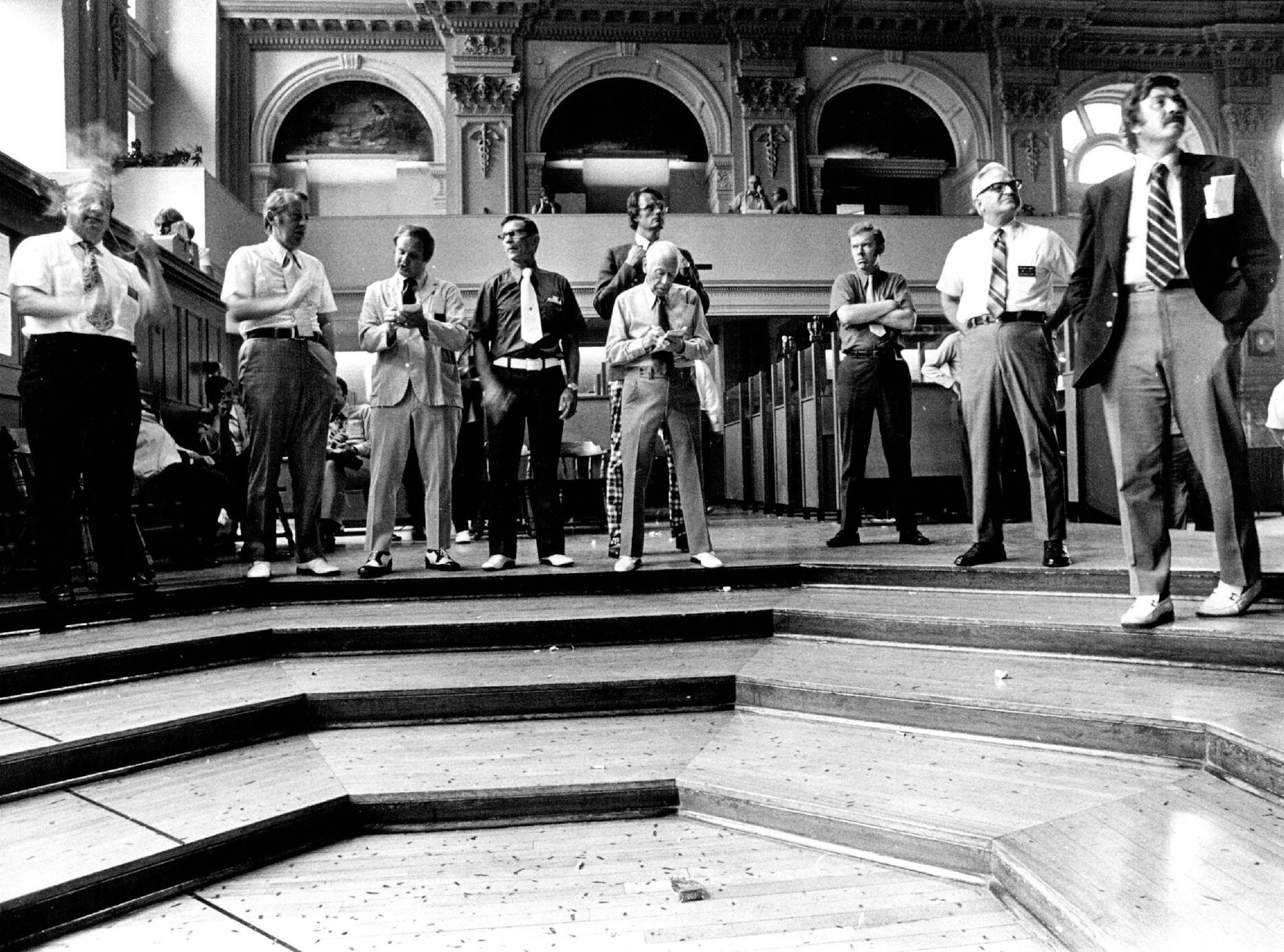 September 21, 1973 For much of the day, the grain pit looks like this -a small group of traders, standing around and watching the changing wheat prices being chalked on the big board. October 14, 1973 Mike Zerby, Minneapolis Star Tribune; Minneapolis Sunday Tribune ORG XMIT: MIN2017012318312738