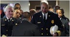 Minneapolis Fire Chief John Fruetel and Assistant Chief Bryan Tyner at the funeral service for longtime Minneapolis civil rights activist Ron Edwards 