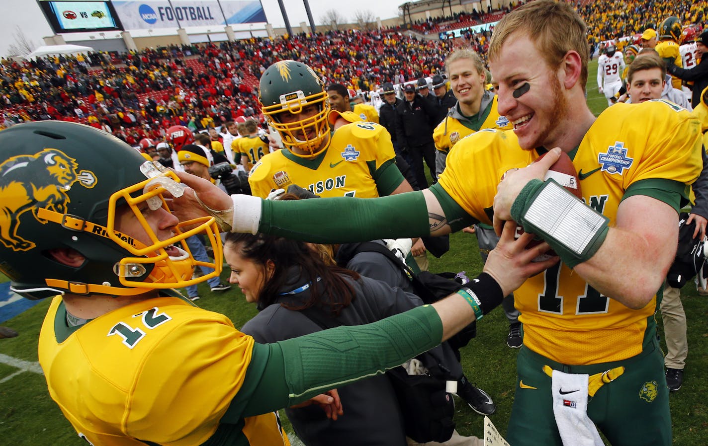 North Dakota State quarterbacks Carson Wentz (11) and Easton Stick (12) celebrate after they defeated Jacksonville State 37-10 in the FCS championship NCAA college football game, Saturday, Jan. 9, 2016, in Frisco, Texas. (AP Photo/Mike Stone)