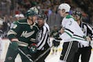Wild center Ryan Carter and Stars defenseman John Klingberg were held back by the refs in a game last February at Xcel Energy Center.