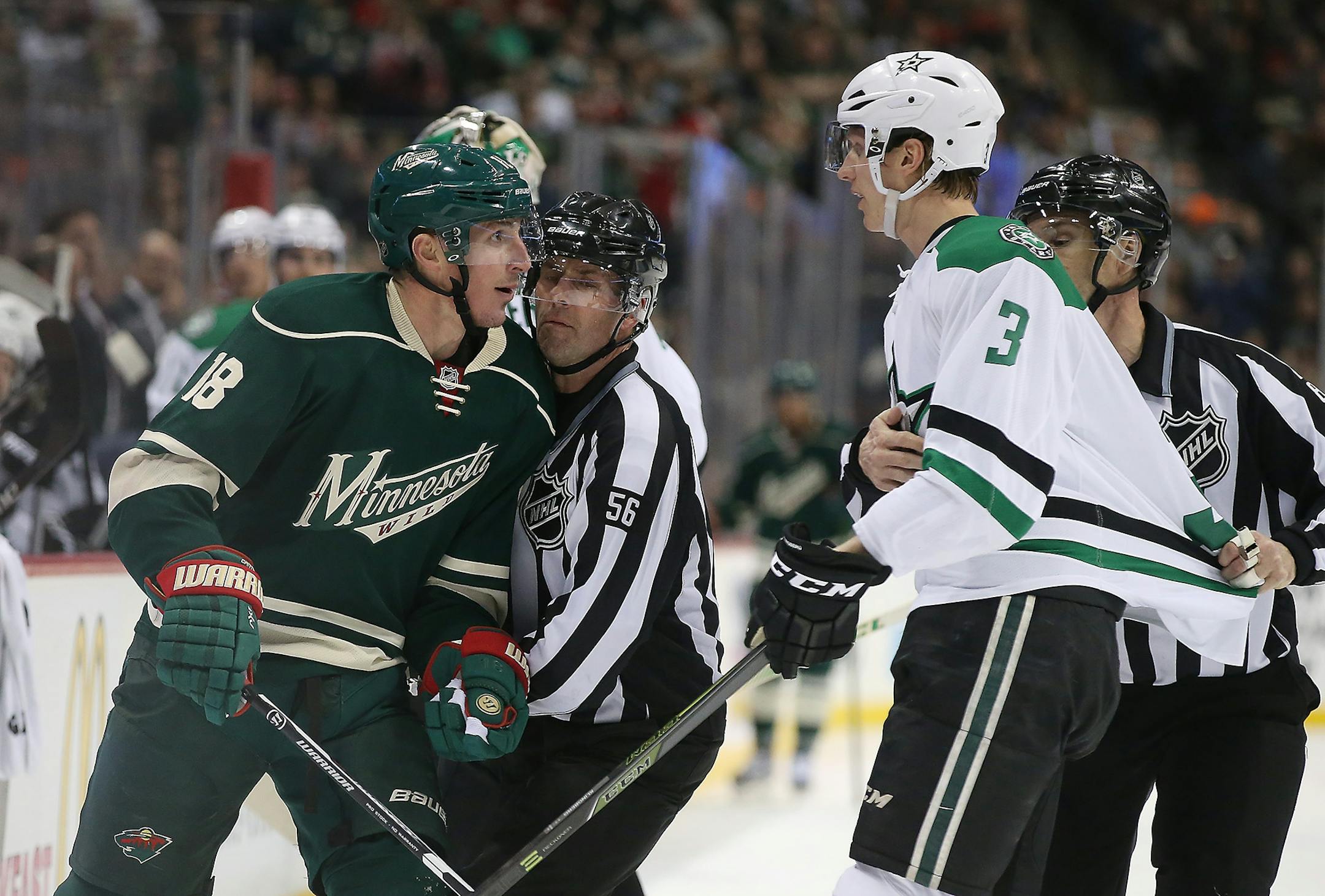 Wild center Ryan Carter and Stars defenseman John Klingberg were held back by the refs in a game last February at Xcel Energy Center.
