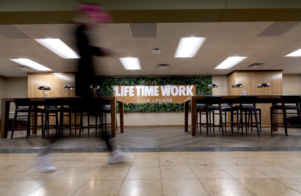A member walks by the Life Time Work club lounge area inside the athletic club in Chanhassen on April 25.