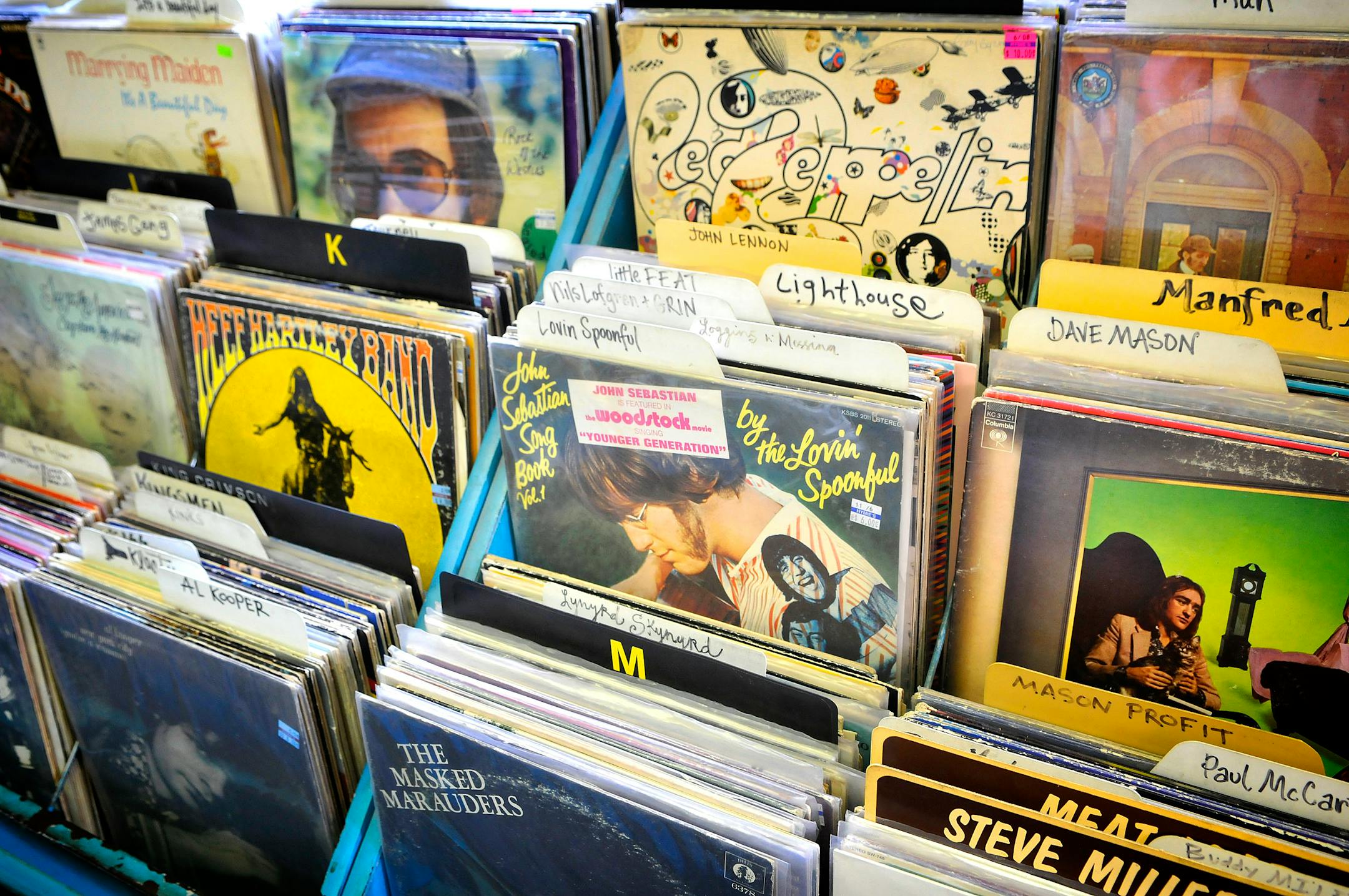 Rock LPs filled the bins at Hymie's Vintage Records on Lake Street in Minneapolis. Vinyl record sales have been increasing at a healthy clip since 2004. Records nonetheless remain a drop in the musical bucket, pulling in just 0.2 percent of total sales last year. CD sales still make up 90 percent of the market.