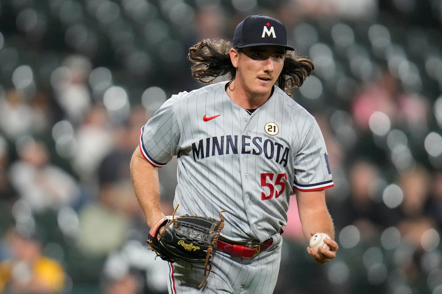 Minnesota Twins relief pitcher Kody Funderburk tosses the ball to first baseman Alex Kirilloff to put out Chicago White Sox's Elvis Andrus to end a baseball game Friday, Sept. 15, 2023, in Chicago. (AP Photo/Erin Hooley)