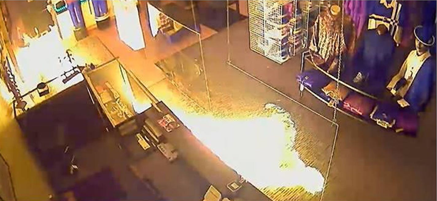 Flames inside the Top 2 Bottom Fashion store in Brooklyn Park