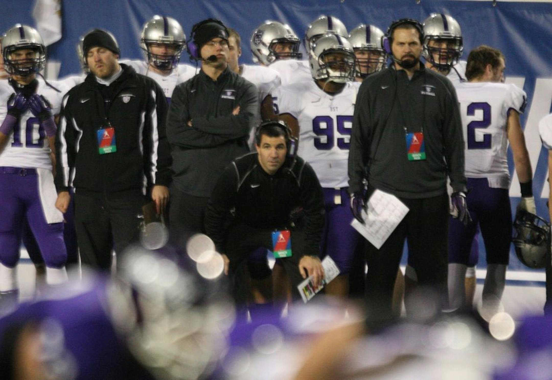 St. Thomas head coach Glenn Caruso, center, watches his team during the second half of the NCAA Division III football championship against Mount Union in Salem, Va., Friday, Dec. 14, 2012. (AP Photo/The Roanoke Times, Daniel Lin) LOCAL TV OUT; LOCAL INTERNET OUT; LOCAL PRINT OUT