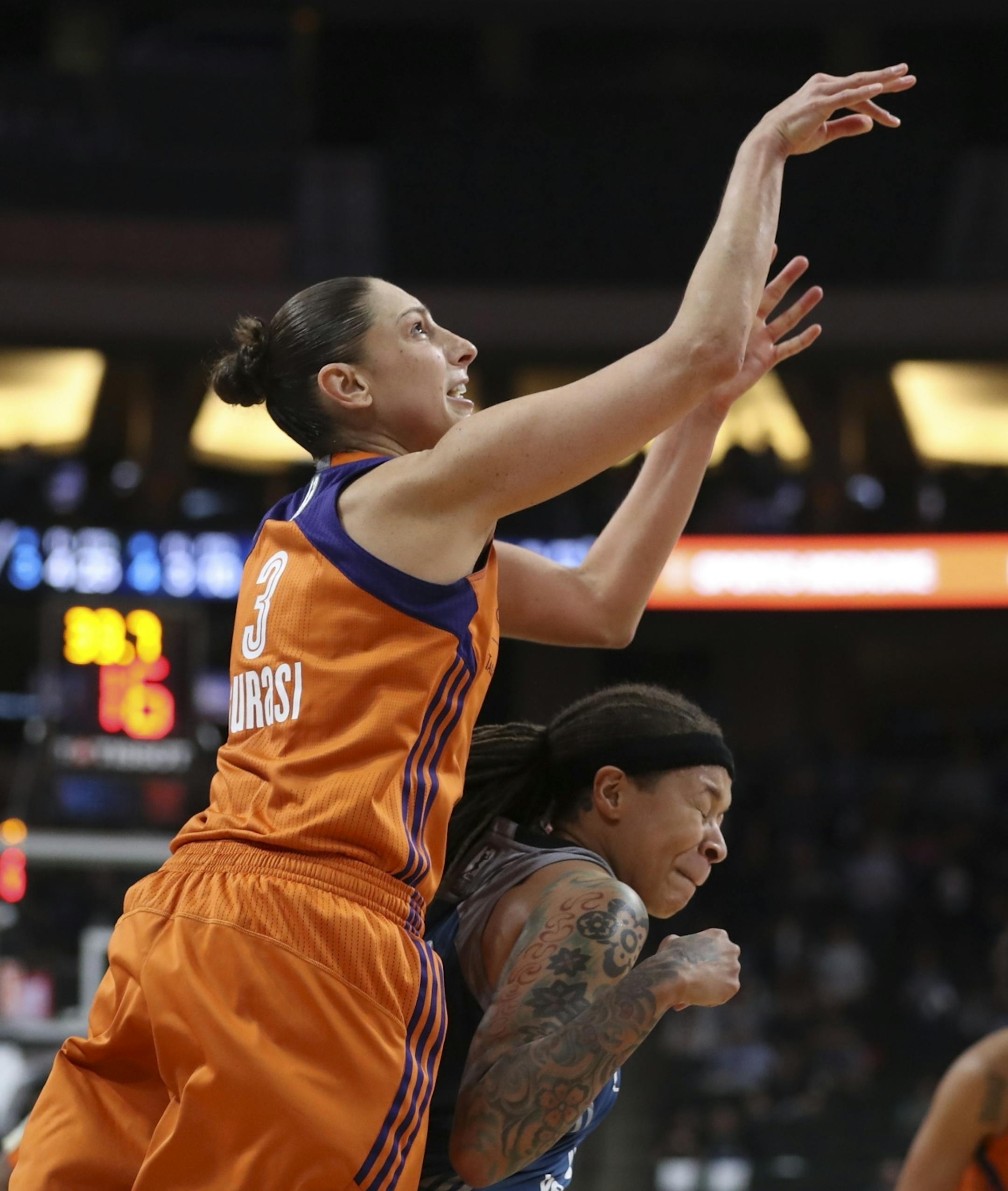 Minnesota Lynx guard Seimone Augustus (33) was called for a foul while defending Phoenix Mercury guard Diana Taurasi (3) late in the fourth quarter.