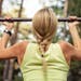 Fit and strong woman doing pullups, chinups istock photo