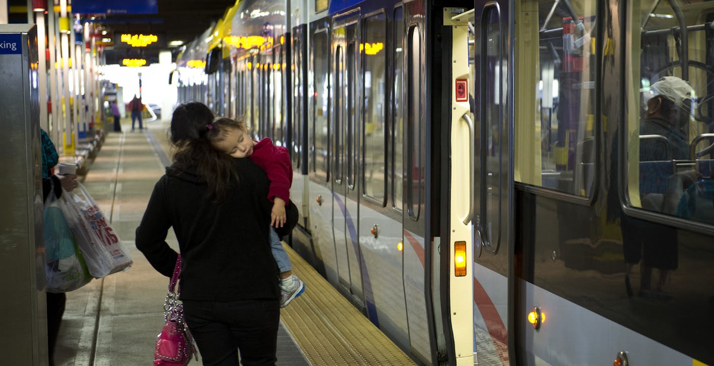 Passengers head to Metro Transit light rail trains at the Mall of America station in Bloomington, Friday, September 21, 2012 ] GLEN STUBBE * gstubbe@startribune.com