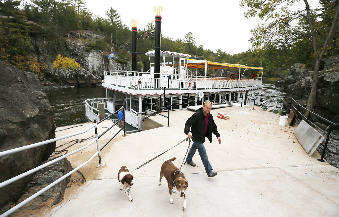 Dan Dahlgren and his dogs Liberty and Trina walked off the Taylors Falls Princess boat Wednesday after a trip down the St. Croix River.