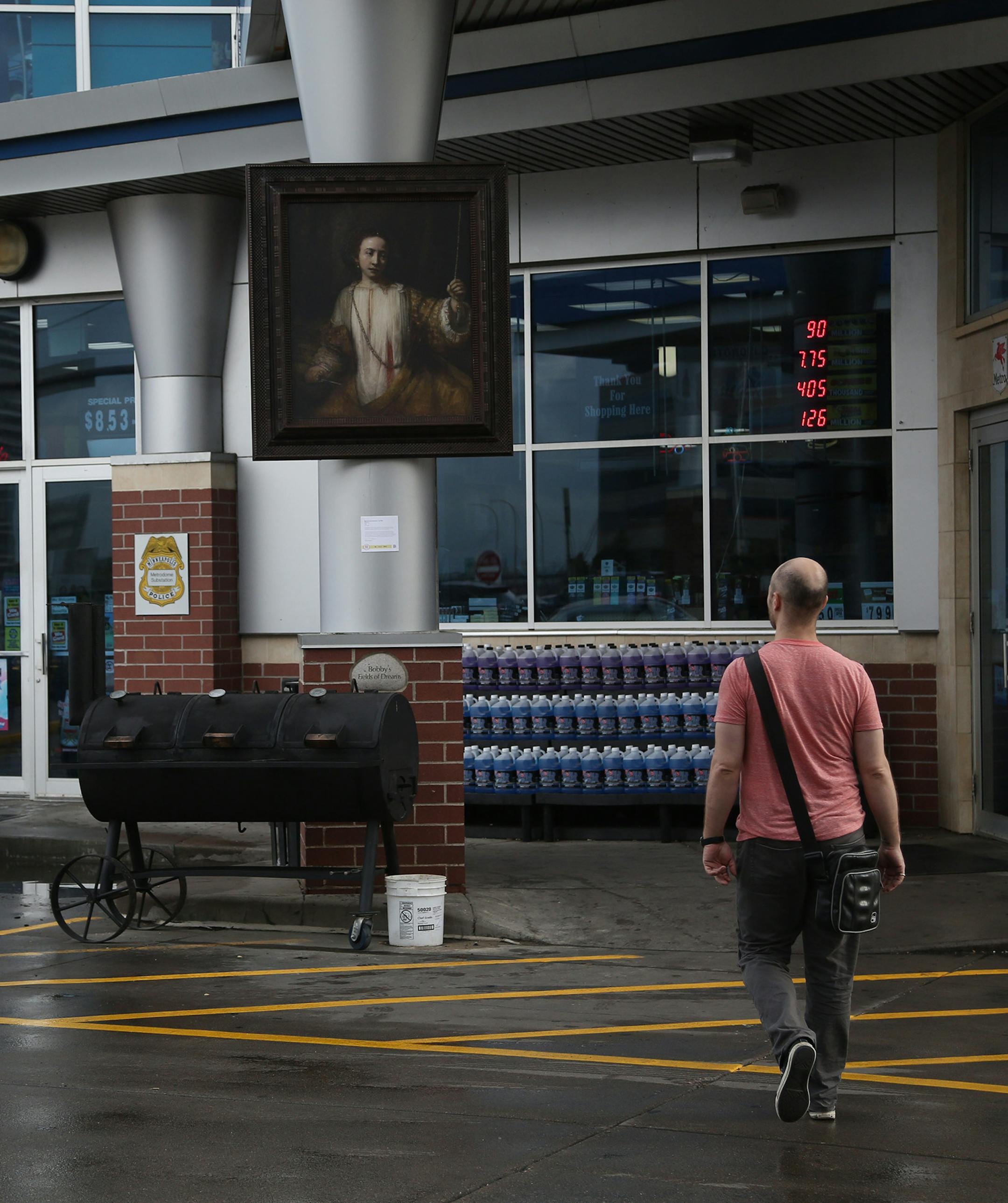 A copy of Rembrandt's "Lucretia." hung outside of Bobby and Steve's gas station. ] (KYNDELL HARKNESS/STAR TRIBUNE) kyndell.harkness@startribune.com In celebration of its centennial the Mpls Institute of Arts has placed high-quality reproductions of three paintings from its collection at unexpected sites around Mpls in Minneapolis Min., Thursday, May 7, 2015.