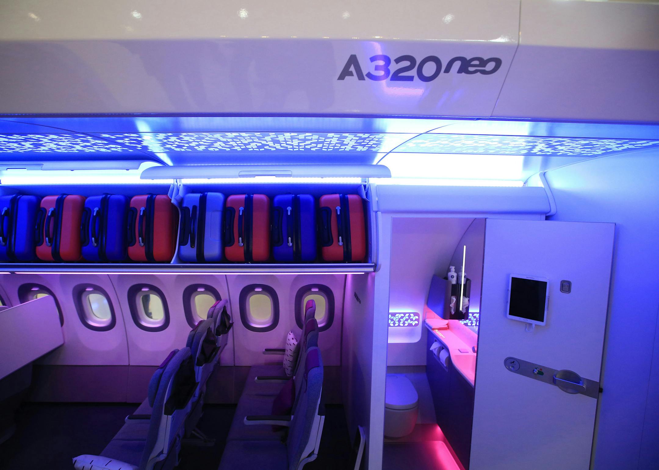 A restroom door stands open inside a new Airbus A320neo cabin at the Aircraft Interiors Expo in Hamburg, Germany, on April 11, 2018. MUST CREDIT: Bloomberg photo by Krisztian Bocsi.