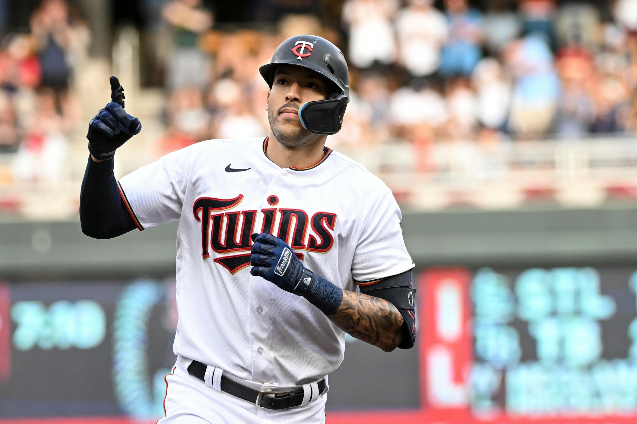 Minnesota Twins shortstop Carlos Correa (4) celebrates a solo home run hit in the bottom of the first inning against the New York Yankees.