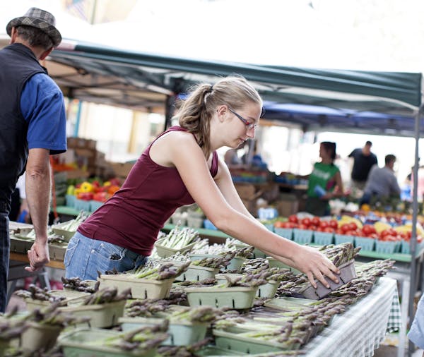 Russ Willenbring and daughter Jeanne sell Produce Acres asparagus at the Minneapolis Farmers Market on weekends.