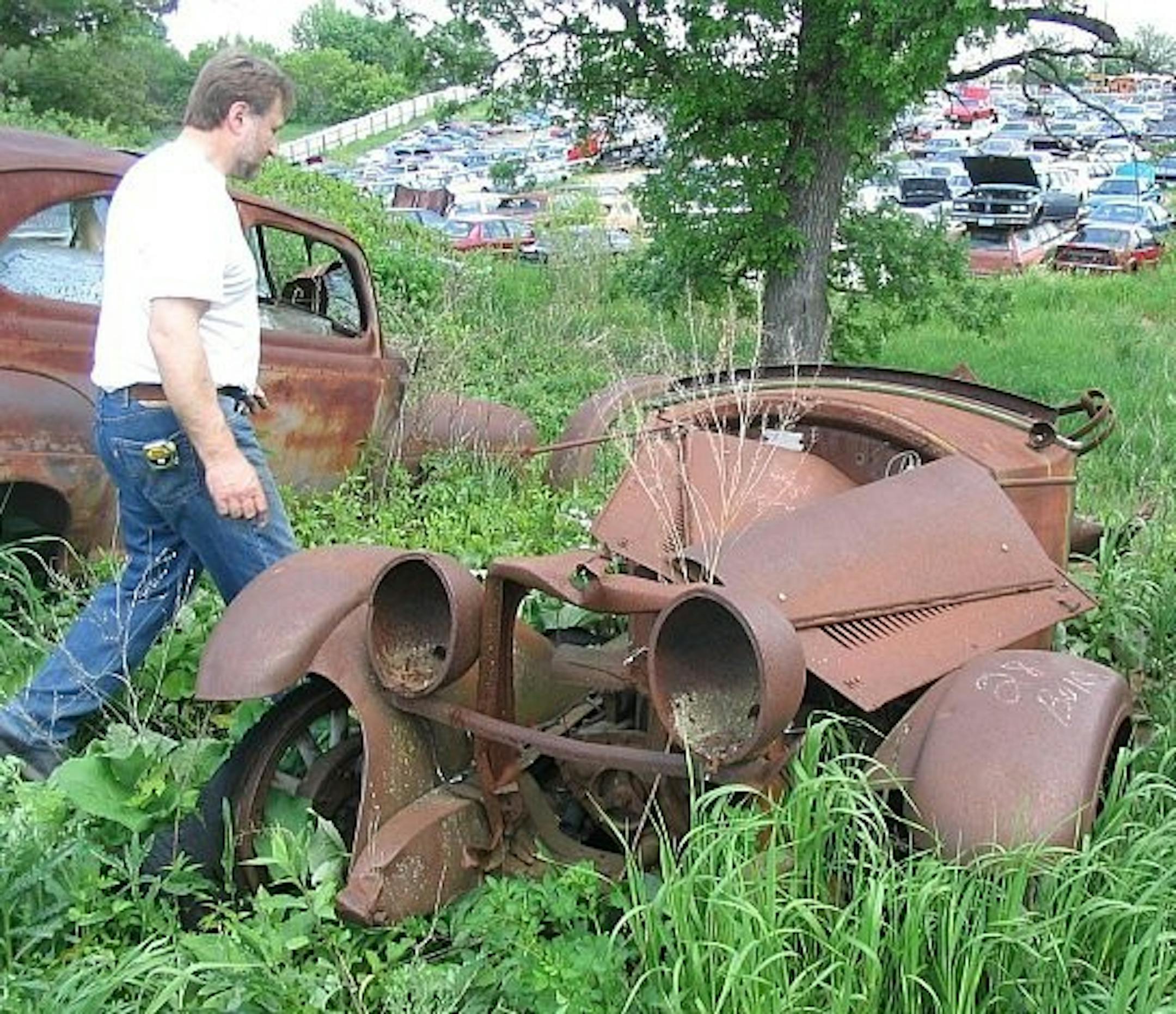 In a junk yard, Linus Vlatkovich begins putting together the pieces of the Rolls Royce featured in "The Great Gatsby" at the Guthrie Theater in 2006.