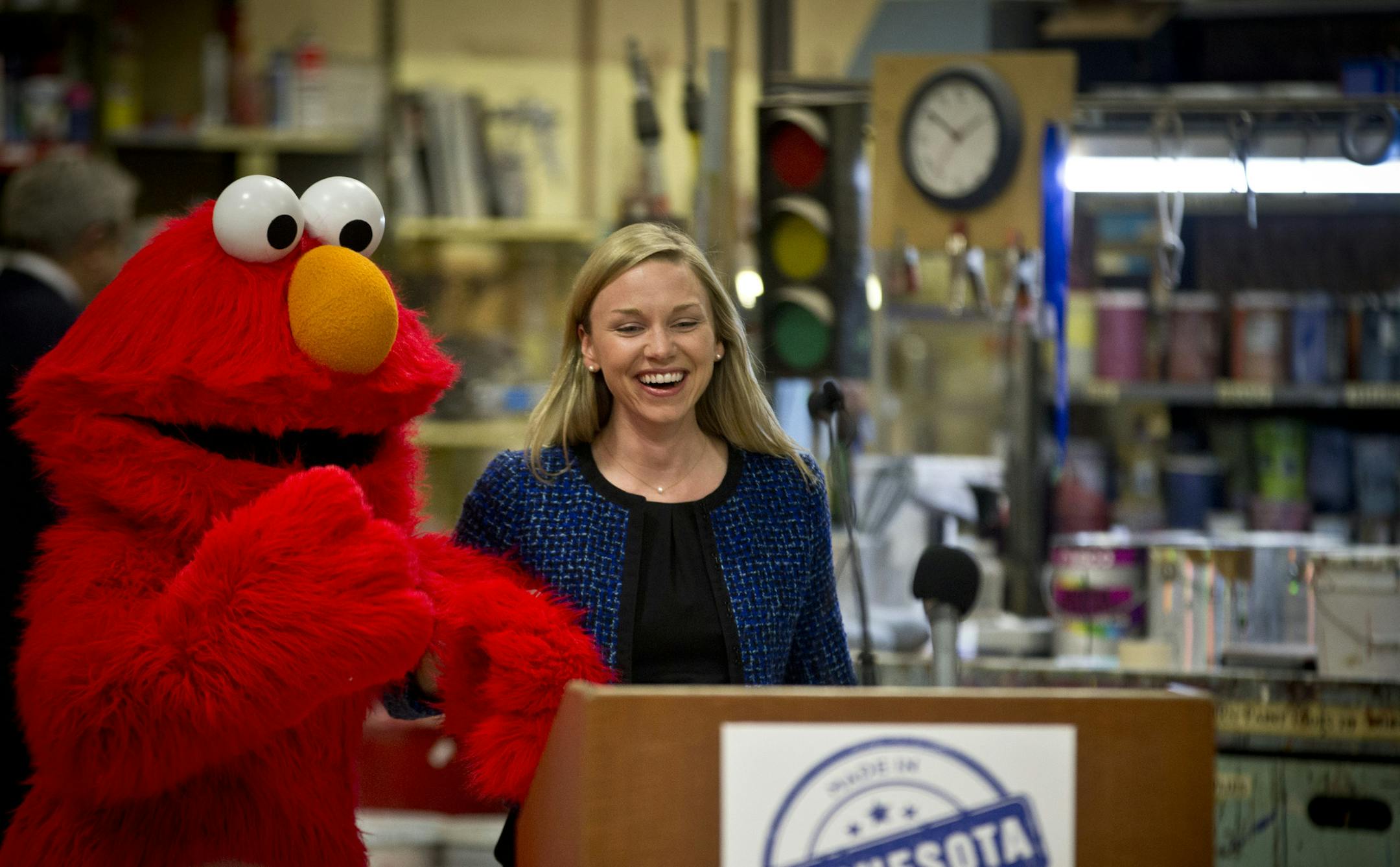 DEED Commissioner Katie Sieben honored Manufacturers Week by unveiling a new Made In Minnesota Directory that includes 600 Minnesota companies at VEE Corporation, one of the 600 companies that makes Sesame Street Live characters among other things, on Tuesday, October 22, 2013, in Minneapolis, Minn. Elmo was part of the press conference. ] RENEE JONES SCHNEIDER &#x2022; reneejones@startribune.com