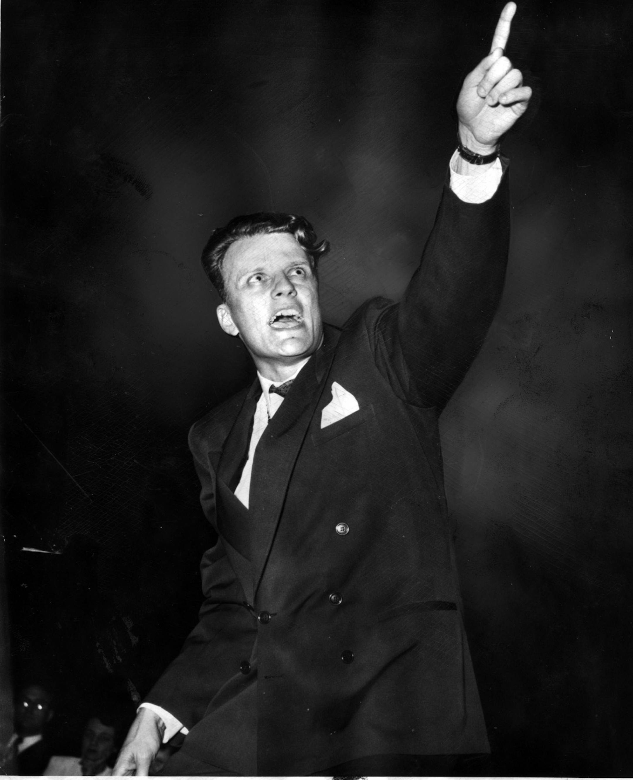 Evangelist and preacher Billy Graham speaking in Minneapolis in January, 1960. File photo.