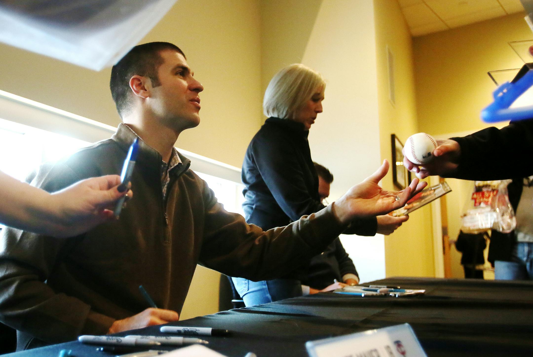 Minnesota Twins first baseman Joe Mauer signed a ball for a fan at Twinsfest Friday, Feb. 23, 2015, at Target Field in Minneapolis, MN.](DAVID JOLES/STARTRIBUNE)djoles@startribune.com Twinsfest Friday, Feb. 23, 2015, at Target Field in Minneapolis, MN.