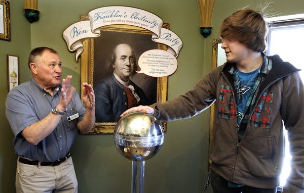 Richard Johnson, (left) a volunteer at the Bakken Museum, shows student Spencer Stanley of North Oaks Academy in Forest Lake a experiment on static el